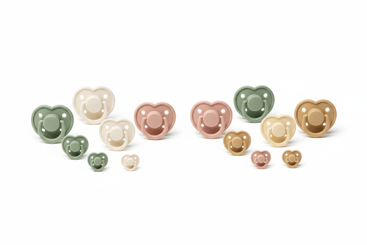 Baby pacifiers in different sizes and materials - silicone and natural rubber latex soothers in pastel Scandinavian colors showing orthodontic and round teat shapes on white background